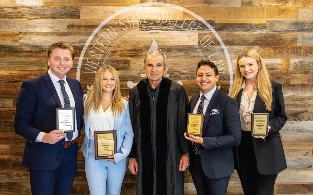 Group of WSCL students and professor after success at moot court competition.