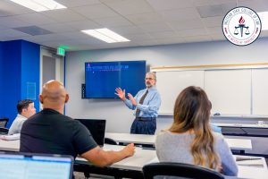 Paul Arshagouni teaching students in a classroom.